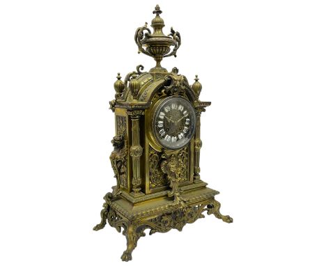 French - Late 19th century brass cased 8-day mantle clock, with a break arch top surmounted by a reeded urn with handles, bra