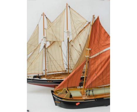 A scale replica model of a two-masted sailing yacht 'Bluenose'; and one other of a fishing trawler (2)