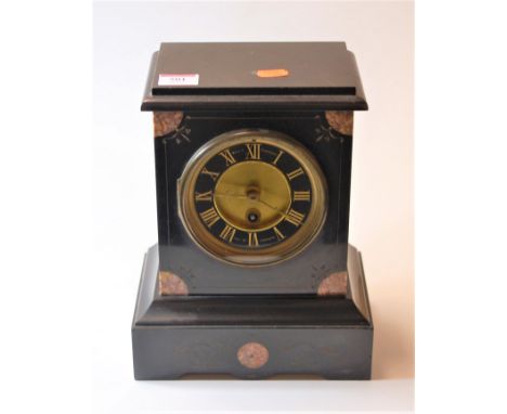 A late Victorian black slate and rouge marble cased mantel clock, having a black enamelled chapter ring, with Roman numerals 