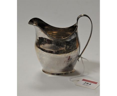 A George III silver helmet shaped cream jug, hallmarked London 1804, 3.5oz