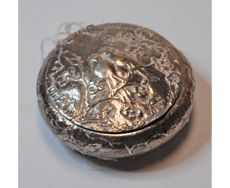 A 19th century Dutch silver pocket snuff box of squat circular form, the hinged lid relief decorated with birds amongst branc