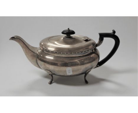 A 20th century silver boat shaped teapot, having an ebonised handle, Sheffield 1933, gross weight 22 oz