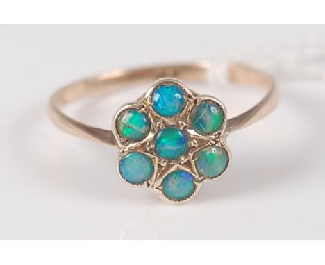 A 9ct gold and opal set flower head cluster ring, 1.7g, size O