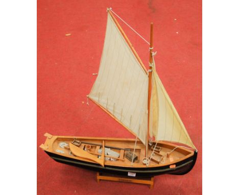 A scale model of the Hooker fishing boat on stand, width 64cm