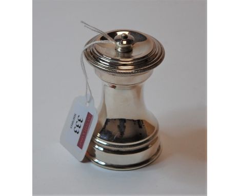 A modern French white metal pepper grinder, of plain undecorated form