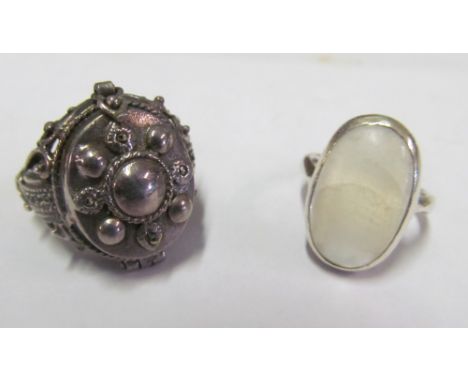 A poison ring and a silver ring