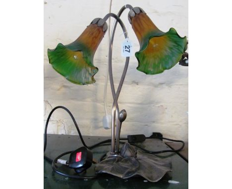 A Tiffany Medya table lamp with two flowerhead shades on lily pad base