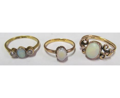 An 18ct gold three stone opal and diamond ring 1.9g size L, gold opal ring 1.2g size I/J, and 9ct gold opal ring 2.1g size P