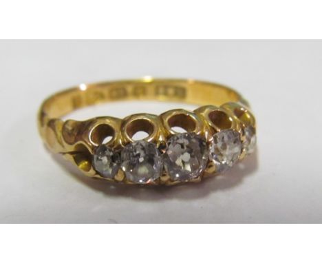 An 18ct gold five stone diamond ring 2.9g size N