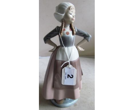 A Lladro figure Dutch girl with hands on hips