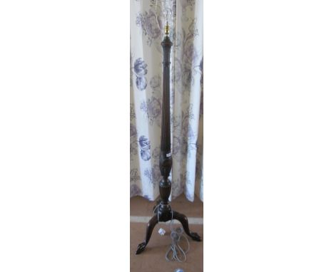A standard lamp on tripod base