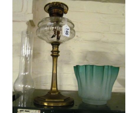 An oil lamp with green frilled shade ( shade ok)