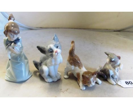 A Lladro figure girl with cat No 5712 and three Lladro cats