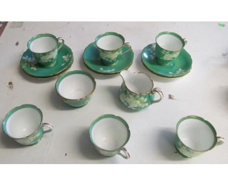 A Noritake green coffee set (chip to cup)