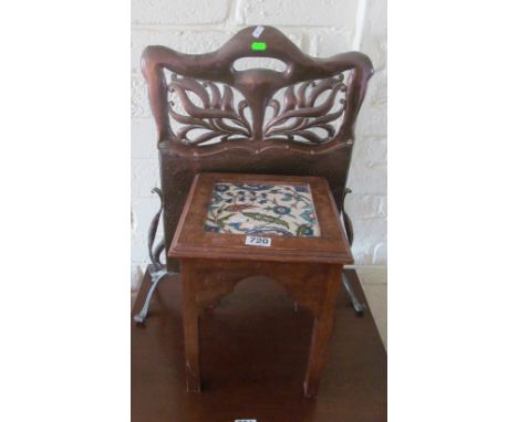 A tile top table and an Art Nouveau copper firescreen