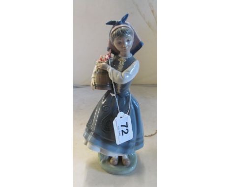 A Lladro figure girl with barrel of flowers