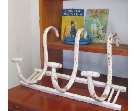 A painted vintage coat rack, enamel chamberstick and two enamel signs