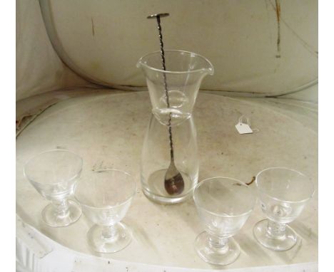 Four Steuben glasses with airtwist stems and a cocktail shaker and stirrer