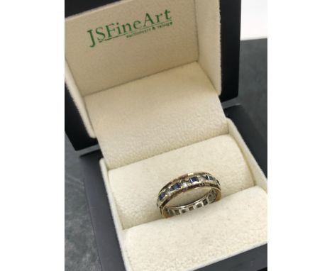 A VINTAGE STONE SET FULL ETERNITY RING. NO ASSAY MARKS ASSESSED AS 9ct GOLD. FINGER SIZE L. 2.72grms. 