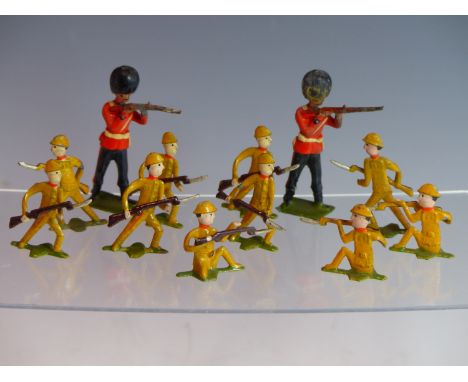TEN VINTAGE JAPANESE DIE CAST SOLDIER FIGURES TOGETHER WITH TWO OTHERS OF BRITISH RIFLEMEN.