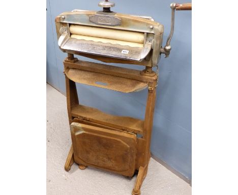 A VINTAGE ACME no55 HOUSEHOLD MANGLE ON ORIGINAL STAND. the proceeds from the sale of this lot will be donated to "Uganda Lod
