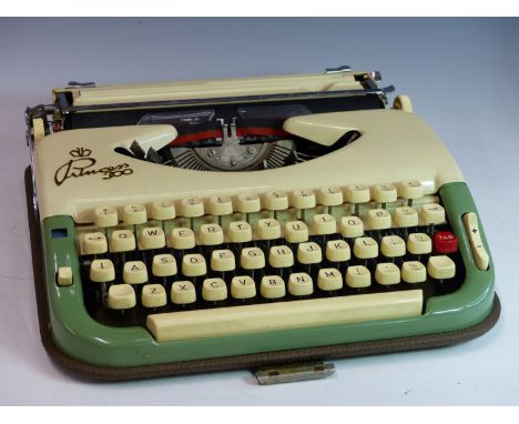 A VINTAGE PRICESS MODEL TYPEWRITER IN CASE.