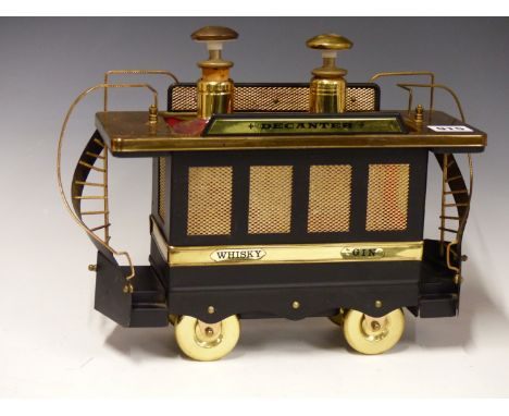 A RETRO MID CENTURY TRAM FORM DECANTER TROLLY. the proceeds from the sale of this lot will be donated to "Uganda Lodge Commun