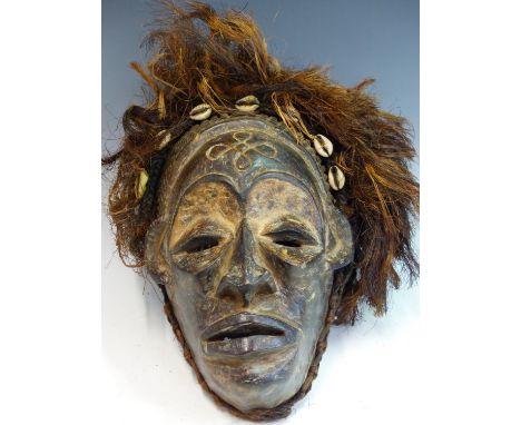 THREE VINTAGE AFRICAN CHOKWE (CONGO) CARVED HARDWOOD MASKS, 2 WITH COWRIE SHELL AND ROPE ROPE HAIR DECORATION the proceeds fr