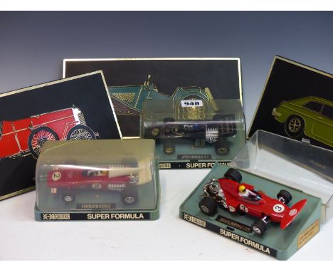 THREE VINTAGE SCALEXTRIC RACING CARS IN ORIGINAL DISPLAY BOXES. TOGETHER WITH THREE UNIPART PLASTIC EASEL BACK CAR DISPLAY PL