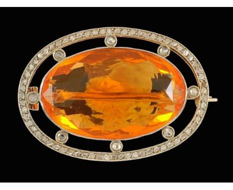 An Edwardian fire opal and diamond brooch, collet set with an oval shaped fire opal within an openwork frame mille grain with