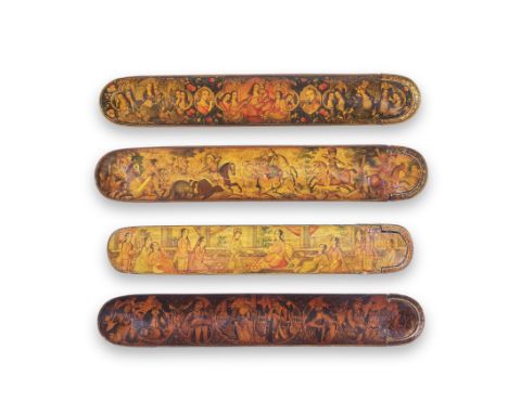 Four Qajar lacquer penboxes (qalamdans) Persia, 19th Centuryeach with rounded ends and sliding tray, variously decorated in p