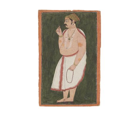 A prince in a white dhoti holding a rose, preparing for puja Bundi or Kotah, late 17th/early 18th Centurygouache and gold on 