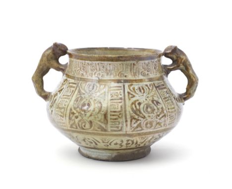 A Kashan lustre pottery vessel Persia, 12th/13th centuryof squat globular form on a short foot with slightly flaring neck and
