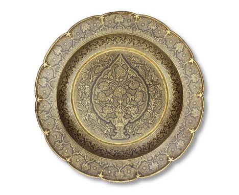A Sialkhot gold koftgari steel dish North India, 19th Centuryof shallow circular form with everted scalloped rim, profusely d