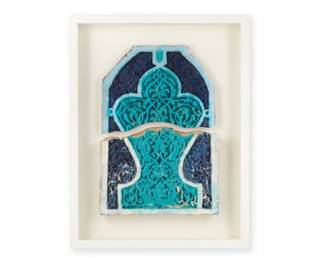 A Timurid moulded pottery mihrab tile fragment Central Asia, second half of the 14th Centurycomprising the lower part of a la