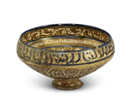 A Kashan lustre pottery bowl Persia, 13th Centuryof deep rounded form on a tall flaring foot, decorated in a golden-brown lus