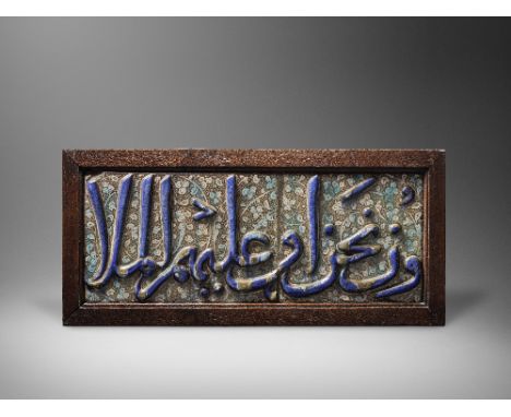 Two Kashan lustre moulded calligraphic pottery tiles Persia, 13th Centuryeach of rectangular form, decorated in cobalt blue, 