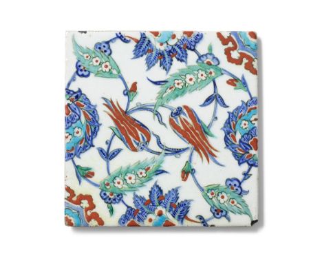 An Iznik pottery tile Turkey, circa 1575of square form, the white ground decorated in raised-red, cobalt blue, turquoise, gre