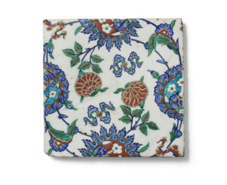 An Iznik pottery tile Turkey, circa 1575of square form, decorated in raised-red, cobalt blue, turquoise and green with black 