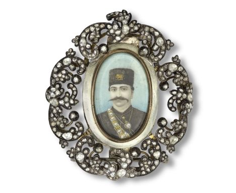 A miniature portrait of Nasr al-Din Shah Qajar (reg. 1848-96) in a diamond-set silver frame Persia, 19th Centurycomprising an