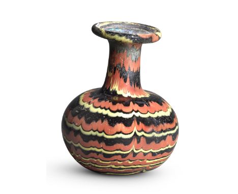 An Abbasid marvered glass bottle Syria or Egypt, 8th/ 9th Centuryof globular form with cylindrical neck and flattened flaring