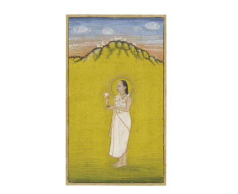 A Vallabhacharya priest standing in a landscape holding a lotus flower Kishangarh, circa 1820gouache and gold on paper, gold 