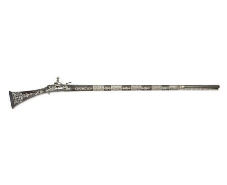A silver-mounted miquelet rifle Algeria, dated AH 1263/ AD 1846the watered steel barrel clasped by five repoussé silver capou