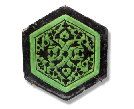 A Timurid underglaze-painted pottery tile Persia, second half of the 15th Centuryof hexagonal form, decorated in black under 