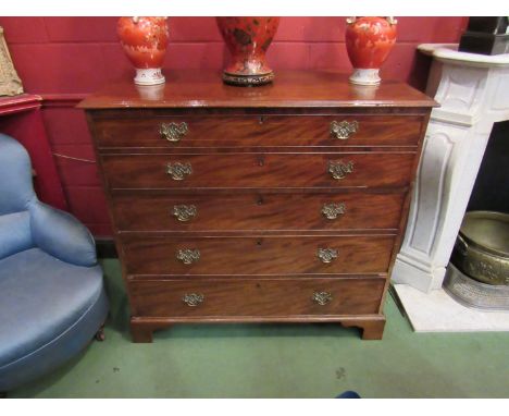 A George III mahogany secretaire chest of drawers with pull out secretaire with pigeon hole and drawer interior over three dr