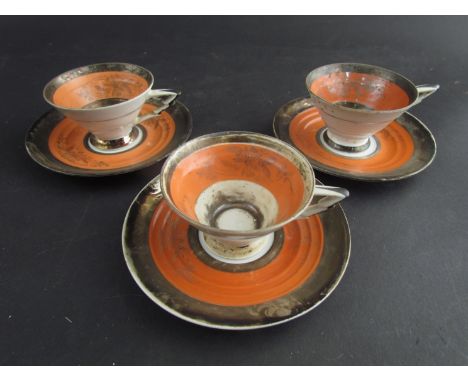 A quantity of Art Deco cups and saucers 