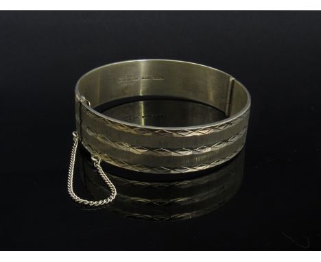 A Birmingham silver stiff hinged bangle