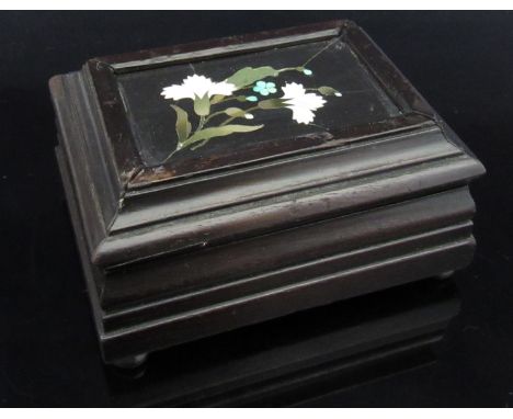 An ebonised wooden trinket box with pietra dura inset lid 