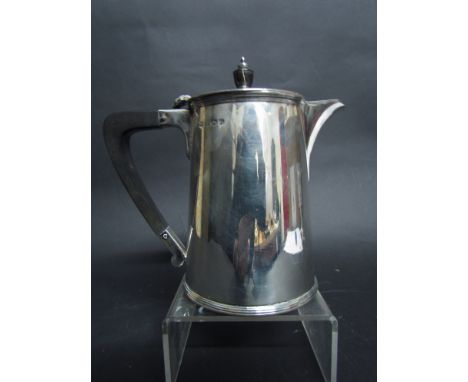 A silver Barker Brothers limited water jug, spout engraved, with treen finial and handles, Birmingham 1931, 16cm tall, 497g t