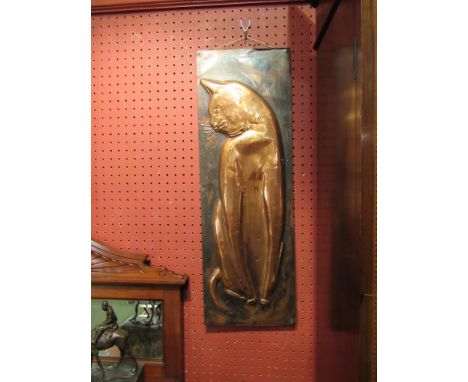 A circa 1970's embossed copper panel depicting a seated cat, signed R. Dent dated 1970, 61cm x 20.5cm